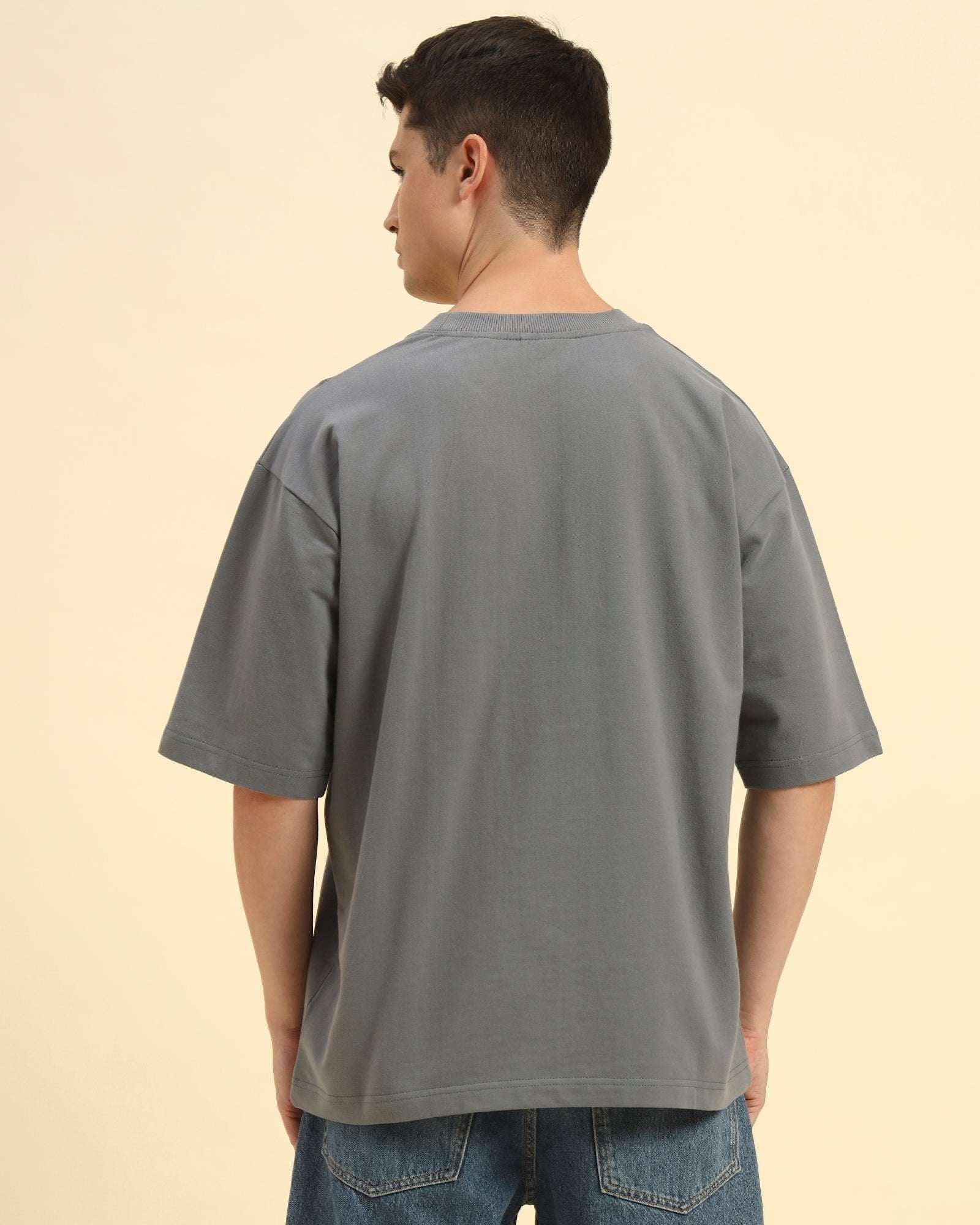Back view of the Dark Grey Aeternum Men's Oversized T-Shirt showcasing the clean shoulder line and comfort-focused cut.