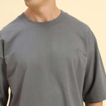 Close-up of the ribbed crew neckline and premium Dark Grey French terry fabric on the Aeternum Men's T-Shirt.
