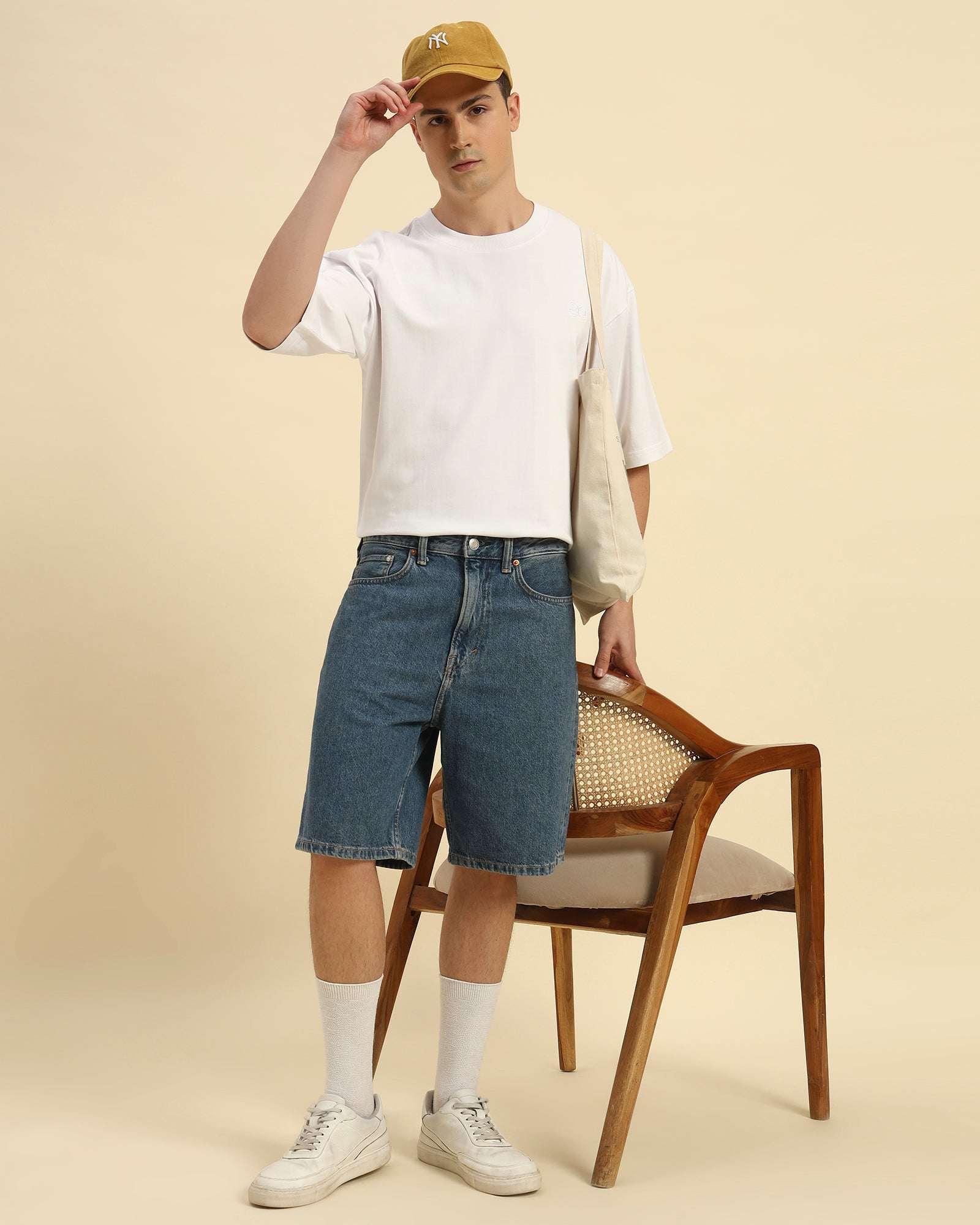 Lifestyle view of the Men's White Oversized French Terry T-Shirt, showcasing its versatile and comfortable design.