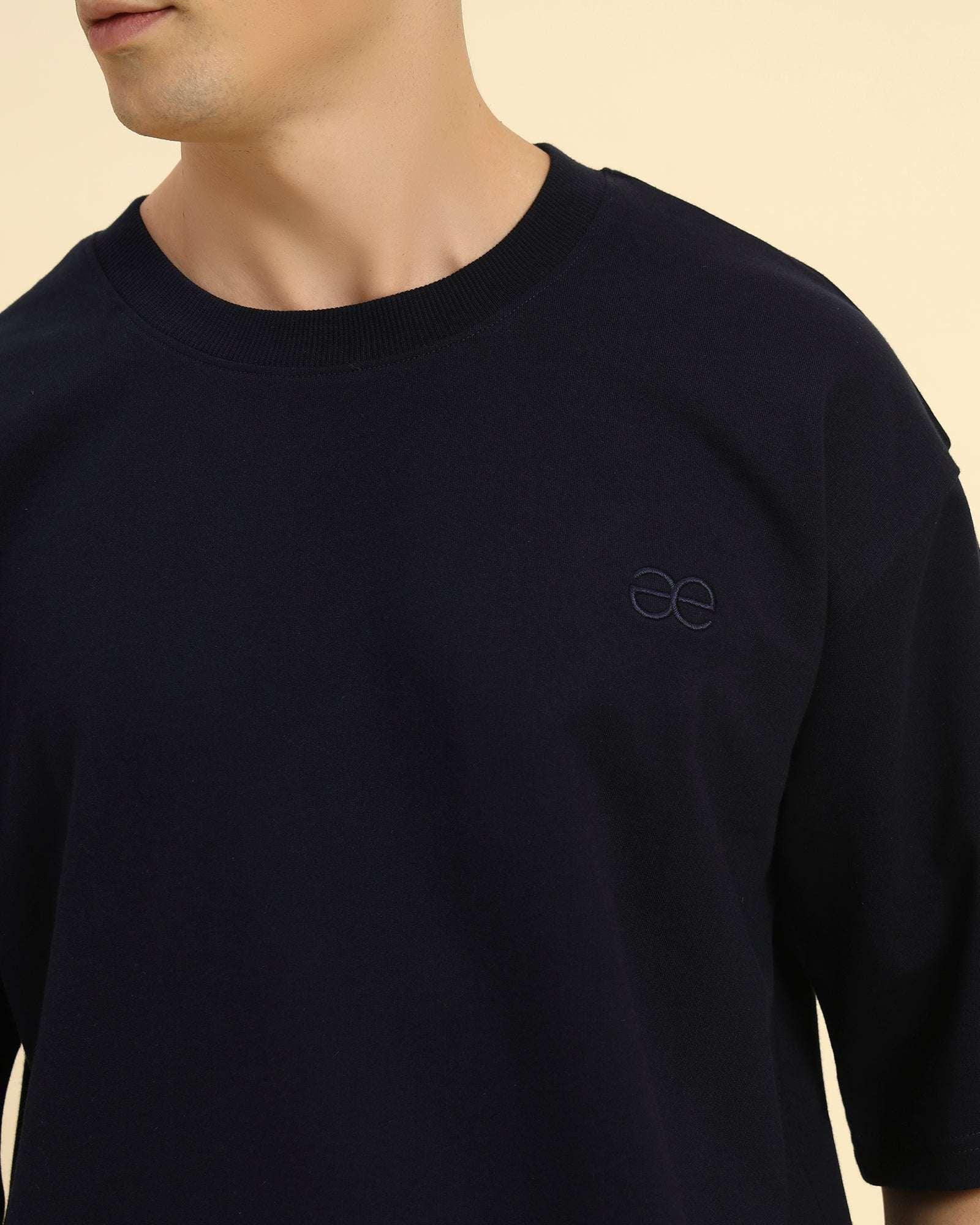 Close-up of the ribbed crew neckline and high-quality French terry texture on the Aeternum Men's Navy Blue T-Shirt.