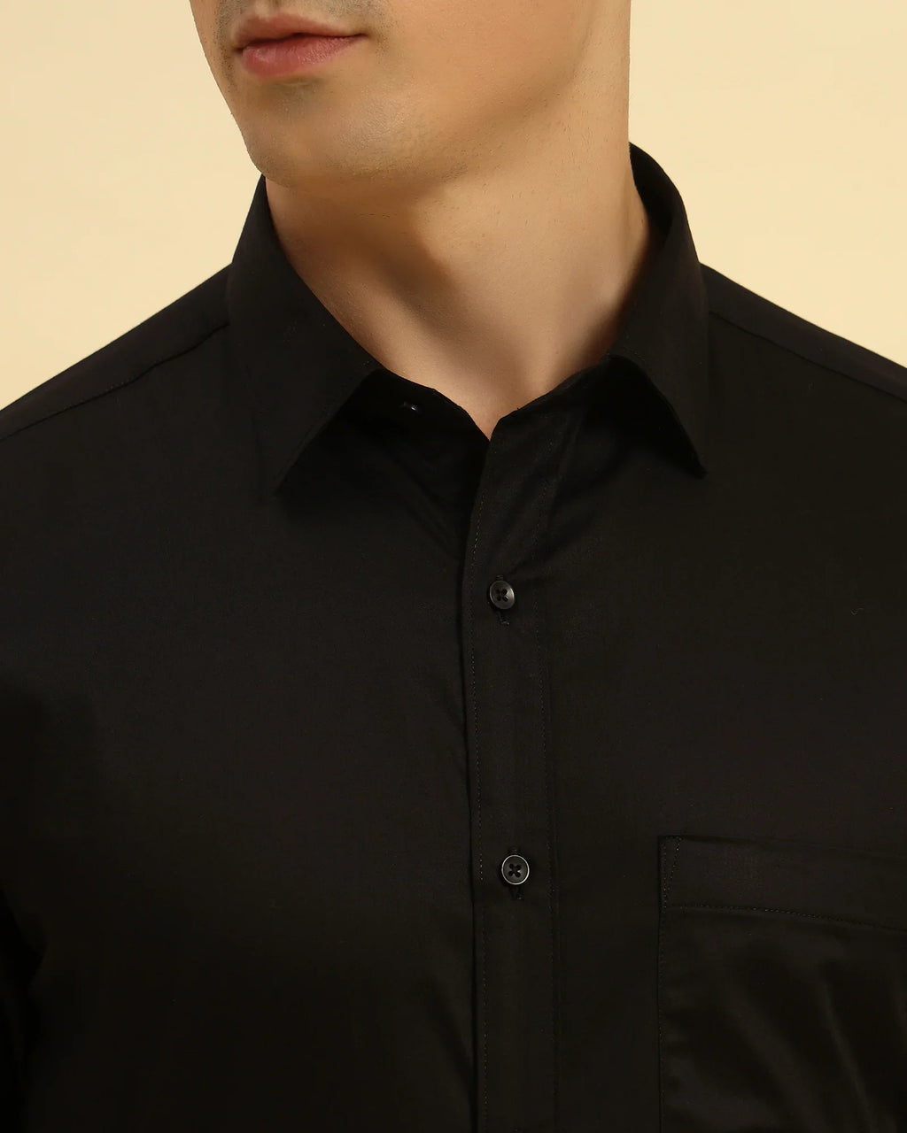 Close-up of the pointed collar and smooth Giza cotton satin fabric texture on the Aeternum Men's Black Shirt.