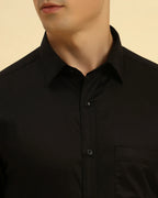 Close-up of the pointed collar and smooth Giza cotton satin fabric texture on the Aeternum Men's Black Shirt.