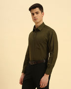 Three-quarter profile of the Men's Dark Green Cotton-Linen Shirt highlighting the effortless drape and relaxed silhouette.