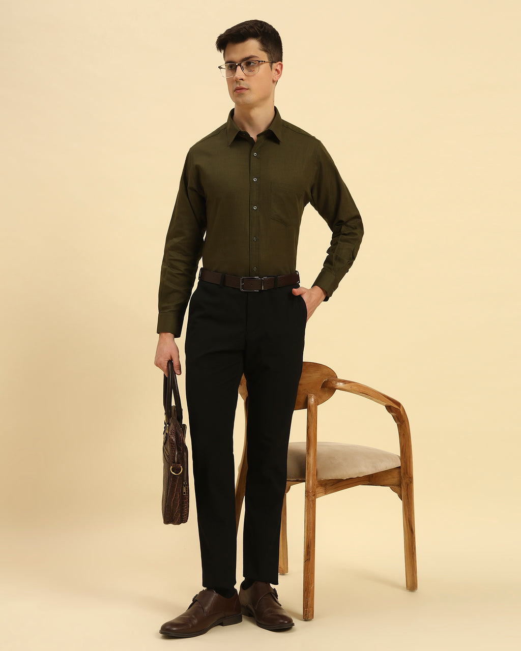 Model seated wearing the Dark Green Aeternum Italian Cotton-Linen Shirt, showcasing its versatility for both casual and formal settings