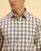 Close-up of the pointed collar and premium woven cotton texture on the Aeternum Men's White & Brown Checked Shirt.