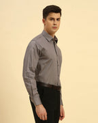 Three-quarter profile of the Men's Dark Grey Aeternum Belgium Giza Shirt highlighting the refined button-down construction.