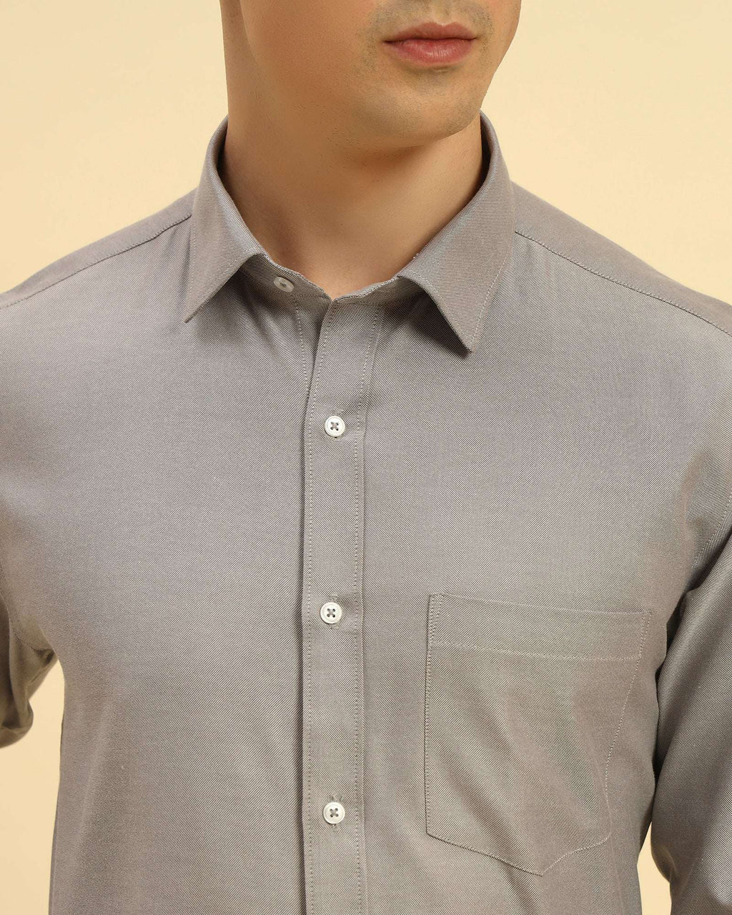 Close-up of the pointed collar and premium textured weave on the Aeternum Men's Grey Cotton-Blend Shirt.