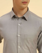 Close-up of the pointed collar and premium textured weave on the Aeternum Men's Grey Cotton-Blend Shirt.