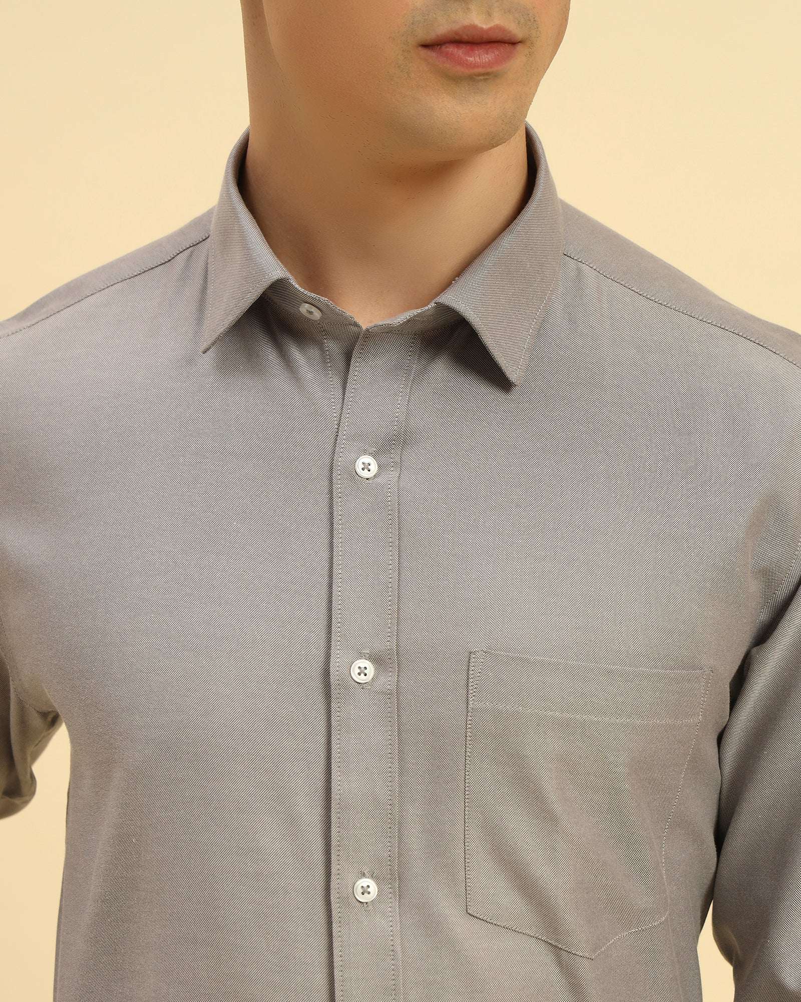 Close-up of the pointed collar and premium textured weave on the Aeternum Men's Grey Cotton-Blend Shirt.