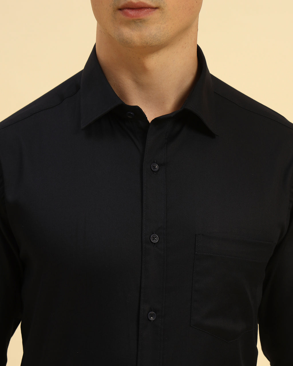 Close-up of the pointed collar and smooth woven texture on the Aeternum Men's Navy Blue Slim Fit Stretch Shirt.