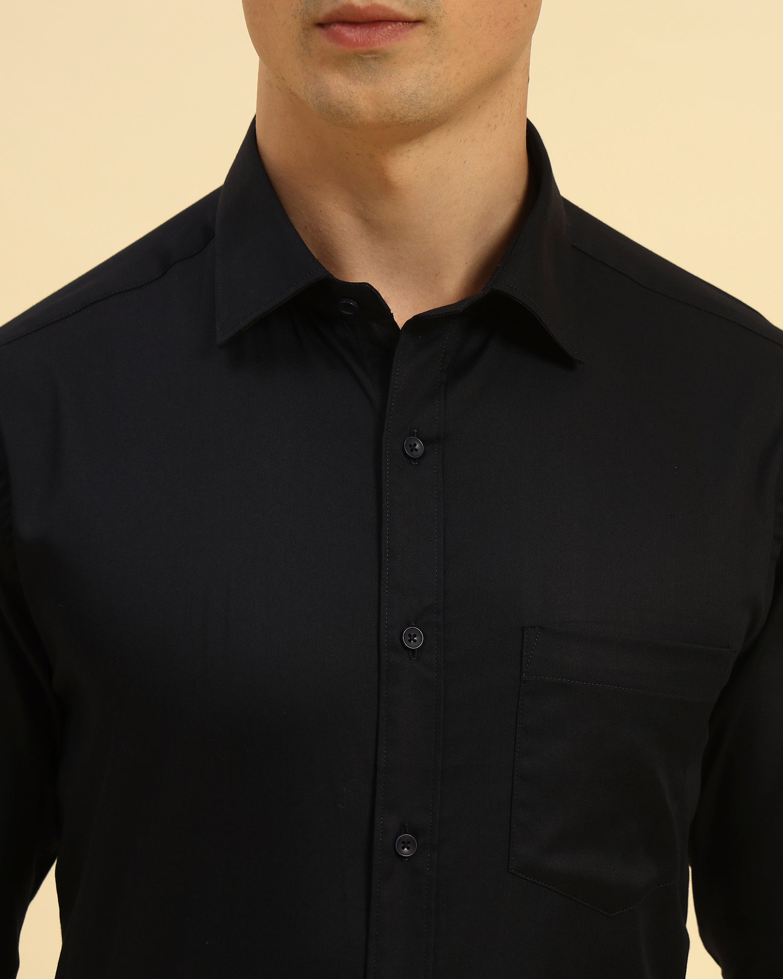 Close-up of the pointed collar and smooth woven texture on the Aeternum Men's Navy Blue Slim Fit Stretch Shirt.