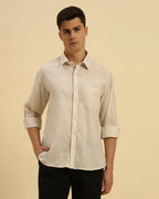 Three-quarter profile of the Men's Beige Cotton-Linen Shirt highlighting the effortless drape and relaxed silhouette.