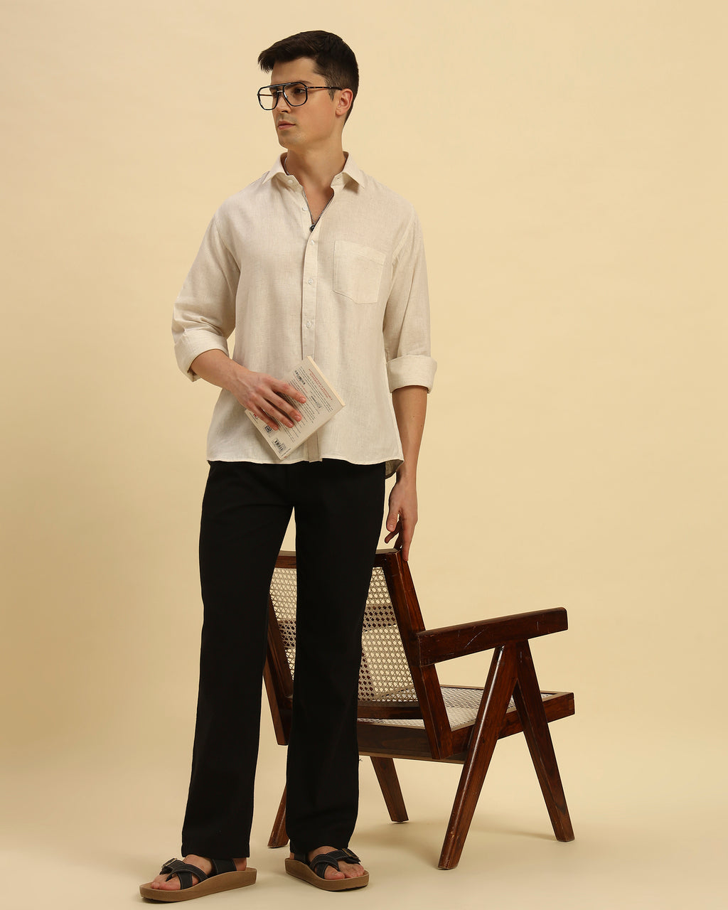 Model seated wearing the Beige Aeternum Relaxed Fit Salerno Shirt, showcasing its versatility for smart-casual wear.