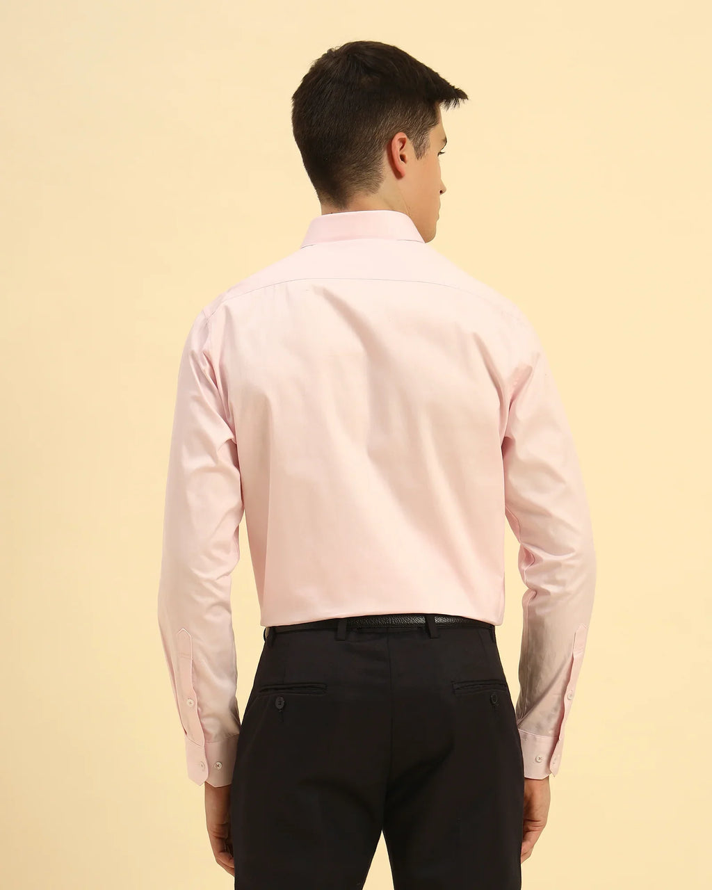 Back view of the Light Pink Aeternum Men's Textured Cotton Shirt demonstrating the clean shoulder line and structured fit.