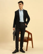 Model seated wearing the Aeternum Men's Sky Blue Corded Shirt, showcasing the fabric's breathable and professional finish.