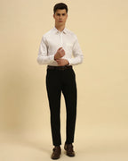 Full body view of the Aeternum Men's White Giza Cotton Satin Shirt styled with black trousers for a formal, polished look.