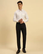 Full body view of the Aeternum Men's White Supima Cotton Shirt styled with black trousers for a formal look.